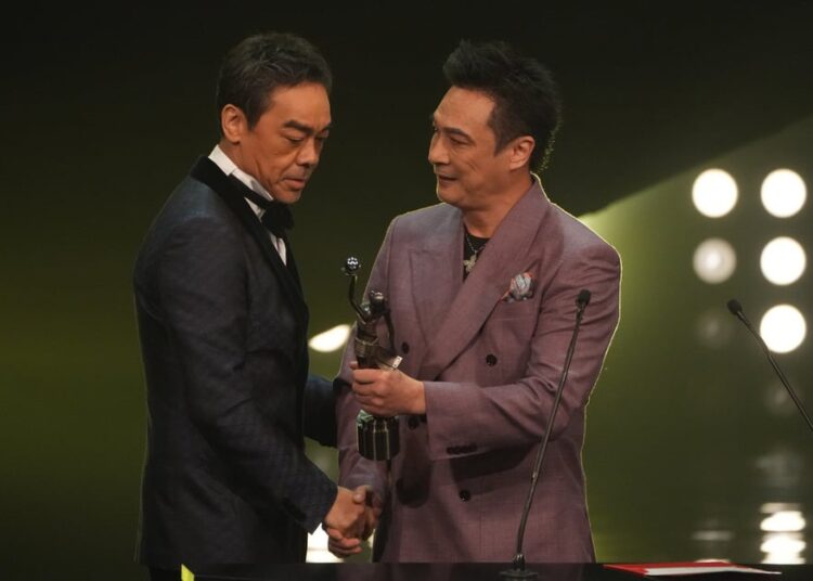 Francis Ng (right) presents Lau Ching-wan with the best actor statue at the 41st Hong Kong Film Awards ceremony in April 2023. Photo: SCMP