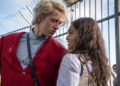 A press image from Lionsgate of Sonw leaning forward to talk to Lucy.