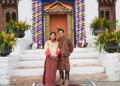 Ugen Choden Namgyel and Prince Jigyel standing outside a building