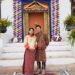 Ugen Choden Namgyel and Prince Jigyel standing outside a building
