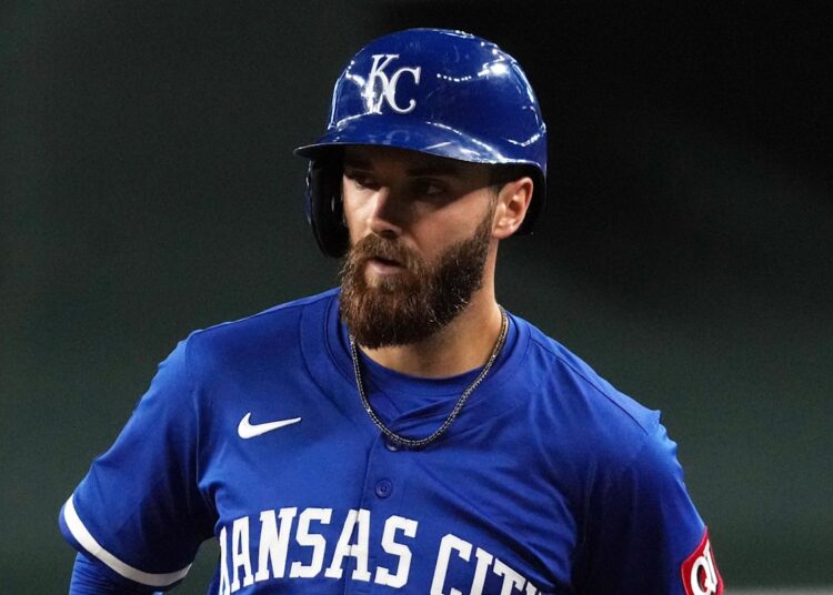 Jul 6, 2025; Phoenix, Arizona, USA; Kansas City Royals outfielder John Rave (26) hits an RBI single against the Arizona Diamondbacks in the fifth inning at Chase Field. Mandatory Credit: Rick Scuteri-Imagn Images