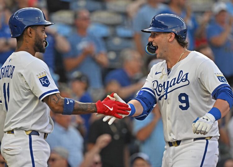Aug 12, 2025; Kansas City, Missouri, USA;  Kansas City Royals first baseman Vinnie Pasquantino (9) celebrates after hitting a three-run home run with third baseman Maikel Garcia (11) in the third inning against the Washington Nationals at Kauffman Stadium. Mandatory Credit: Peter Aiken-Imagn Images