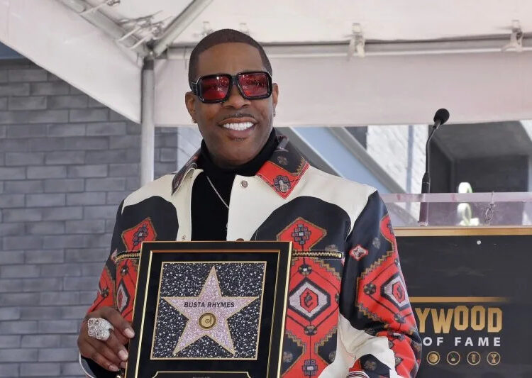 Busta Rhymes holds a replica plaque during an unveiling ceremony honoring him with the 2,818th star on the Hollywood Walk of Fame on Aug. 1. Photo by Jim Ruymen/UPI