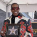 Busta Rhymes holds a replica plaque during an unveiling ceremony honoring him with the 2,818th star on the Hollywood Walk of Fame on Aug. 1. Photo by Jim Ruymen/UPI