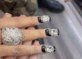 black nails with large rhinestones