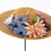 Country Music Hall of Fame member Minnie Pearl wore this straw hat, decorated with cloth flowers and dangling $1.98 price tag, at her Opry debut in 1940.