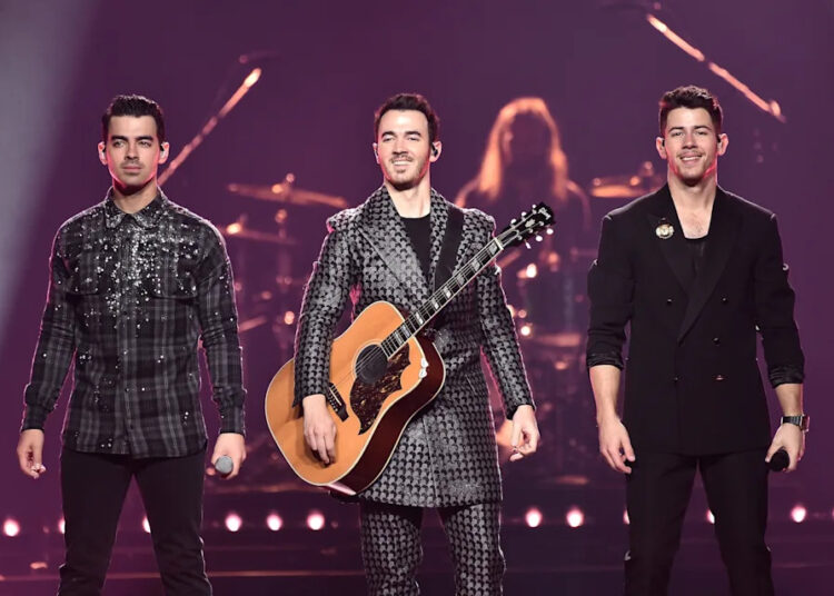 Joe Jonas, Kevin Jonas, and Nick Jonas of The Jonas Brothers perform at Barclays Center on November 23, 2019 in New York City.