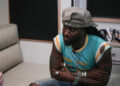 Country artist Shaboozey sits down for an interview with The Enquirer during the Voices of America Country Festival at the VOA Park in West Chester on Aug. 8.