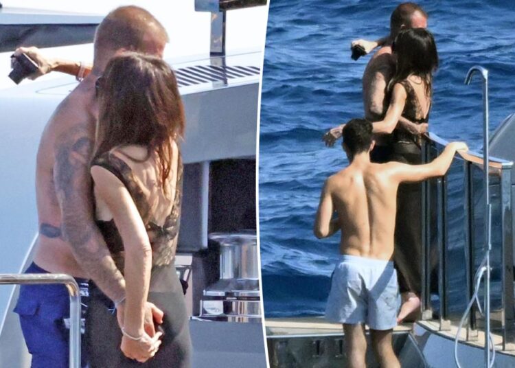 Shirtless David Beckham grabs handful of Victoria's butt during Italian yacht trip with kids
