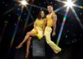 Dr Punam Krishan and Gorka Márquez for Strictly Come Dancing in yellow outfits on a glitzy star background.