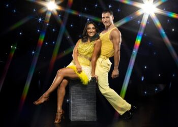Dr Punam Krishan and Gorka Márquez for Strictly Come Dancing in yellow outfits on a glitzy star background.