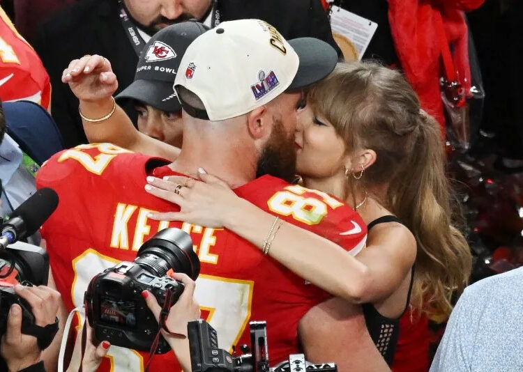 Kansas City Chiefs tight end Travis Kelce kisses his girlfriend Taylor Swift after the Chiefs defeated the San Francisco 49ers 25-22 in overtime to win Super Bowl LVIII in 2024. Swift announced her upcoming 12th album during an episode of his Kelce's podcast. File Photo by Jon SooHoo/UPI