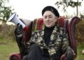 A still image of Alan Cumming.