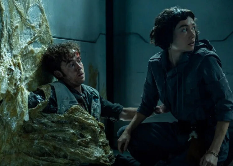 FX’s Alien: Earth — “Metamorphosis” — Season 1, Episode 3 (Airs Tuesday, August 19) — Pictured (L-R): Alex Lawther as Hermit, Sydney Chandler as Wendy. (Credit: Patrick Brown/FX Networks)