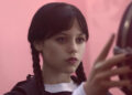 Jenna Ortega as Wednesday Addams in Netflix's Wednesday Episode 203 looking coldly at someone.
