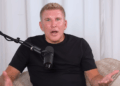 Todd Chrisley and a podcast mic.