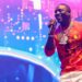 Image may contain Akon Performer Person Solo Performance Leisure Activities Music Musical Instrument and Musician