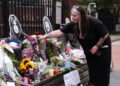 Floral tributes were left on the Black Sabbath Bridge bench on Broad Street in Birmingham following Ozzy Osbourne's death.