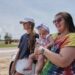 Fans Emma Touchstone, 17, left, and Kelsey Heath with her four-month-old daughter Maggie Fields wait for reality television star Todd Chrisley walks out of the Federal Prison Camp, Wednesday, May 28, 2025, in Pensacola, Fla. (AP Photo/Dan Anderson)