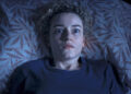 Julia Garner waking up for a nightmare in Weapons.