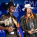 Lil Nas X, left, and Billy Ray Cyrus show off their Musical Event of the Year award backstage during the 53rd annual CMA Awards show at Bridgestone Arena in Nashville on Nov. 13, 2019.