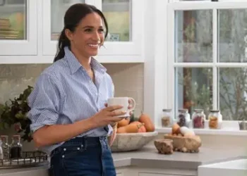 Netflix A picture of Meghan standing in a kitchen