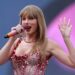 Photo of pop star Taylor Swift singing during a concert.