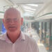 Photograph of Mike Matthews from the Grand Arcade shopping centre. he is pictured with the shopping mall behind him.