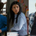 From left to right: Alex leaning against a gate, Jackie sitting at her desk looking to her right and Cole looking to his left in My Life with the Walter Boys. .