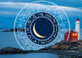 Collage of a lighthouse at night with the ocean in the background. An illustrated wheel of zodiac signs with a waning crescent moon in the middle sits tucked behind the rocks and lighthouse.