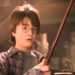 Harry Potter with a wand from Harry Potter and the Sorcerer's Stone.