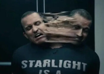 A person in a "Starlight is a..." shirt with a distorted face, suggesting a special effect or action scene