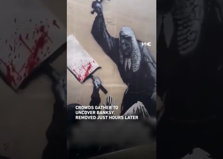 Banksy protester mural at London’s Royal Courts of Justice removed after attempts to remove barriers