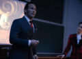 Ed and Lorraine Warren give a presentation on a stage in The Conjuring: Last Rites