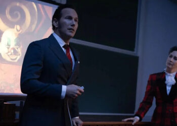 Ed and Lorraine Warren give a presentation on a stage in The Conjuring: Last Rites