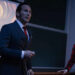Ed and Lorraine Warren give a presentation on a stage in The Conjuring: Last Rites