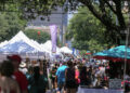 Hundreds of attendees walk among tents and booths along Sixth Street on May 8, 2022 during the Pecan Street Festival. (Aaron E. Martinez/American-Statesman)