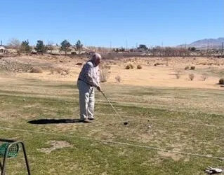 Dianna Morales Leroy Burdick playing golf.