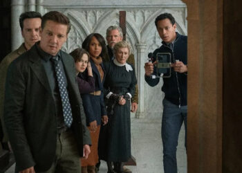 image from wake up dead man knives out trailer of people looking into a closet with shock
