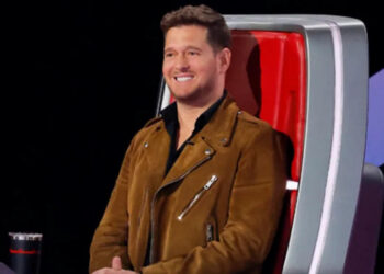 Michael Buble smiles as he listens to a Blind Audition on The Voice Season 28.