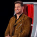 Michael Buble smiles as he listens to a Blind Audition on The Voice Season 28.
