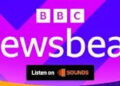 A footer logo for BBC Newsbeat. It has the BBC logo and the word Newsbeat in white over a colorful background of violet, purple and orange shapes. At the bottom a black square reading "Listen on Sounds" is visible.