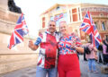 Attendees waved Union flags enthusiastically during the show, against a backdrop of protesters carrying the flag in London