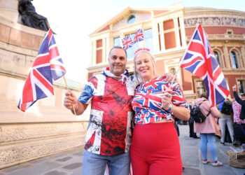 Attendees waved Union flags enthusiastically during the show, against a backdrop of protesters carrying the flag in London