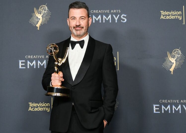Jimmy Kimmel poses in the press room with the award for host for a game show for "Who Wants to Be a Millionaire" during night two of the Creative Arts Emmy Awards at the Peacock Theater in Los Angeles. (Photo by Richard Shotwell/Invision/AP)