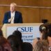 CSUF alum Tom Mehrmann speaks to a group of students.