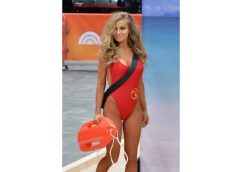 Carmen Electra wears the Baywatch red swimsuit