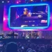 BBC Giant live screen showing Stevie Wonder playing a piano and performing on stage in Cardiff, wearing his trademark glasses and a cap