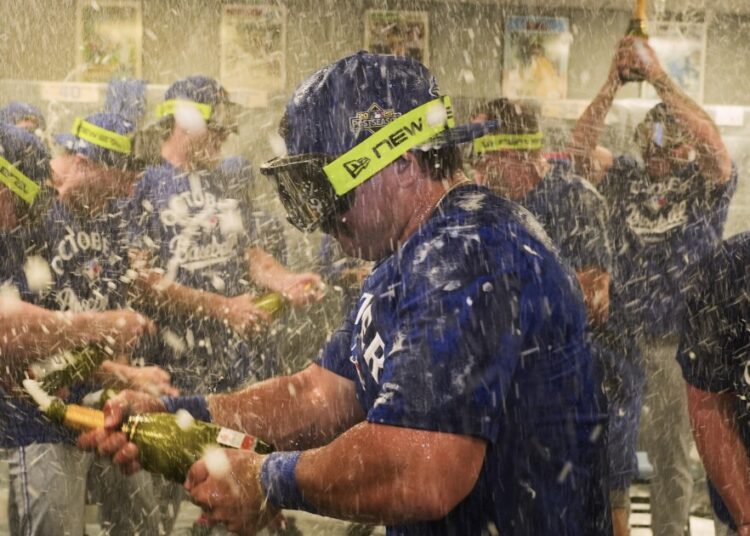 Blue Jays are 1st AL team to clinch playoff spot in 8-5 win over Royals