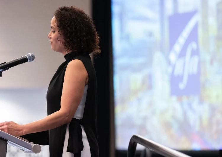 Jennifer Grim speaking at the National Flute Association convention in August.